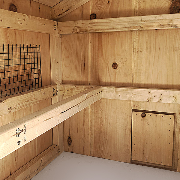 wood interior with roost bar and ventilation opening
